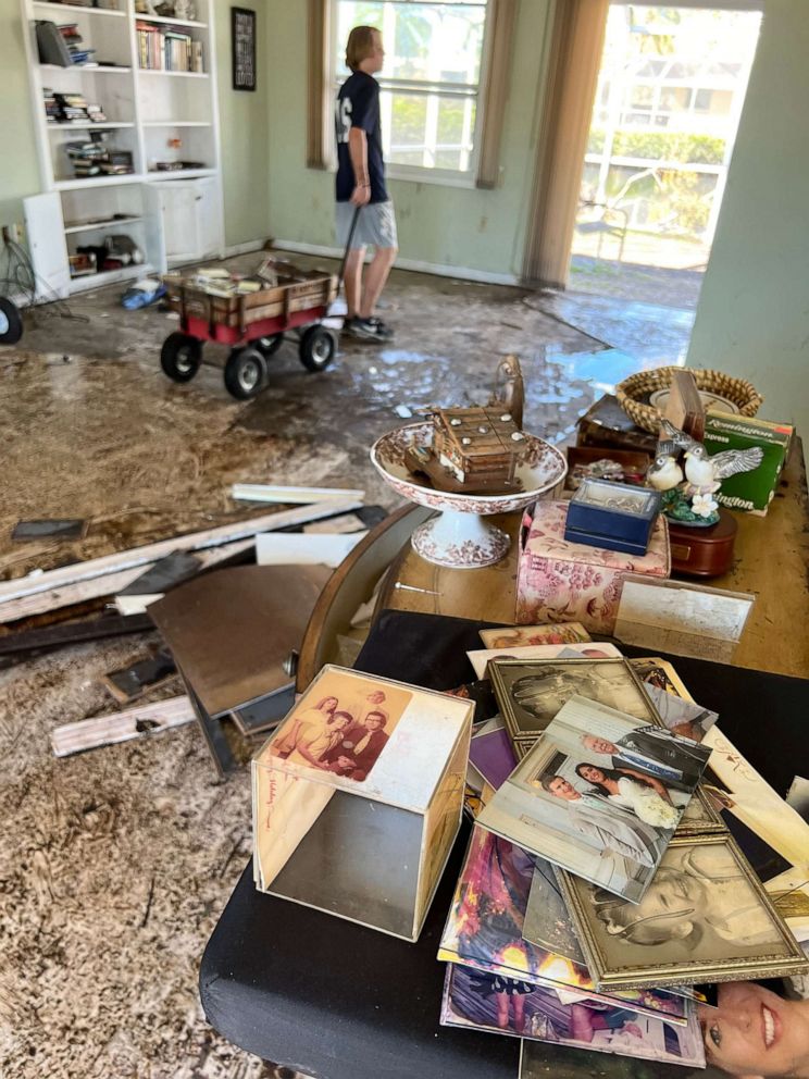 PHOTO: Photos are piled in an area of a Fort Myers, Florida, home damaged during Hurricane Ian.