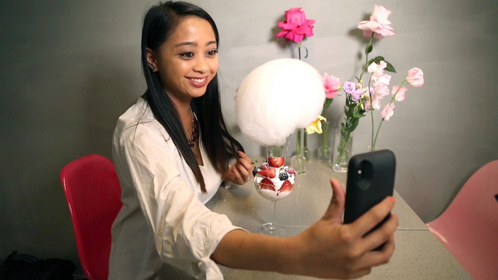 PHOTO: Angeline Bernabe takes a selfie with the Cloud Nine dessert at LROOM Cafe.