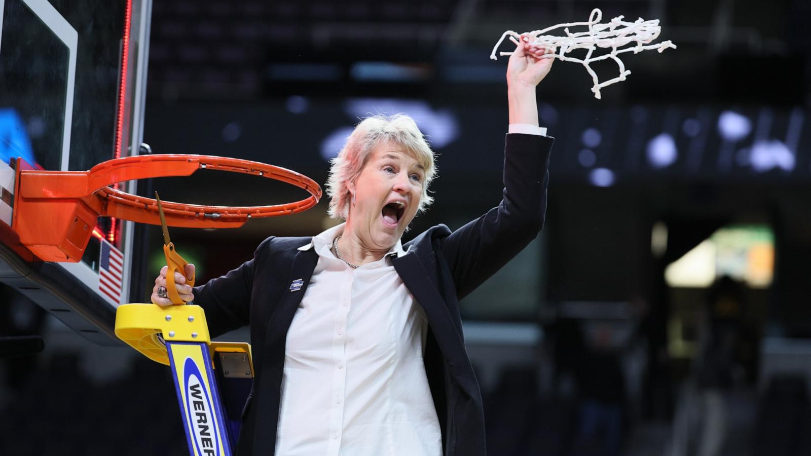 PHOTO: Head coach Lisa Bluder of the Iowa Hawkeyes celebrates as she cuts down the net after beating the LSU Tigers in the Elite 8 round of the NCAA Women's Basketball Tournament at MVP Arena, April 1, 2024, in Albany, New York.