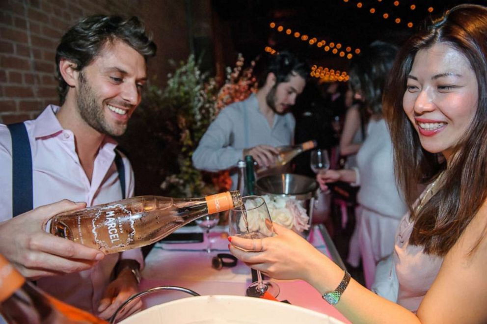 PHOTO: Albert Dahan, founder and CEO of Maison Marcel Wines pours a glass of rose at a wine tasting event.