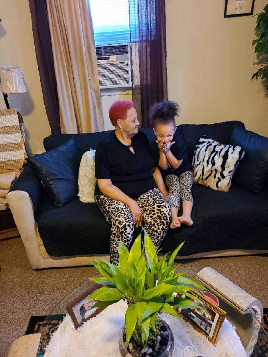 PHOTO: Dehvea Boxley sits with her great-grandmother.