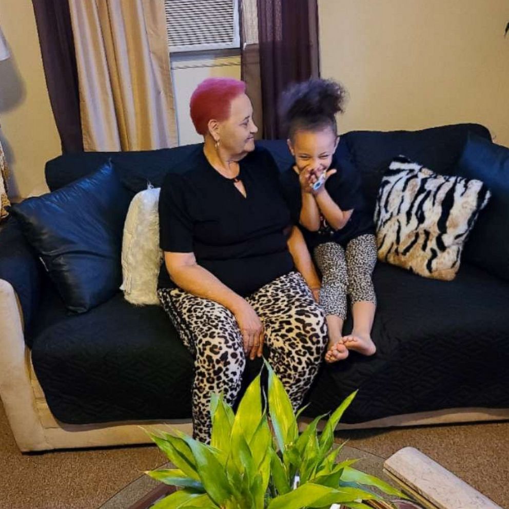 PHOTO: Dehvea Boxley sits with her great-grandmother.