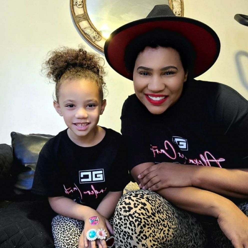 PHOTO: Lashaunastey Turberville sits with her daughter Dehvea.