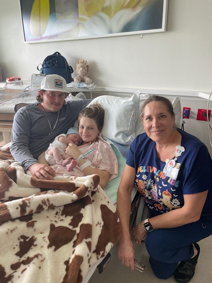 PHOTO: Dewey Bennett III, Kenzie Lewellen and their son Dewey Lester Bennett IV with Andrea Zullo, one of their nurses at Sarasota Memorial Hospital in Sarasota, Fla.