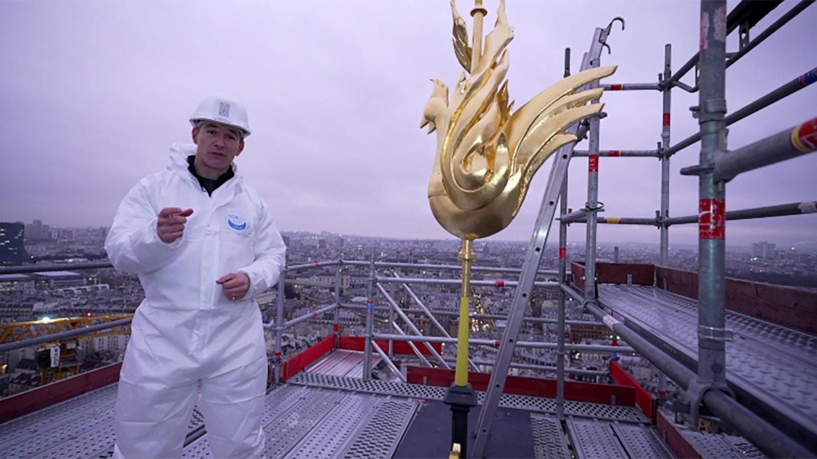 PHOTO: ABC News’ James Longman stands on top of the newly renovated spire of Notre Dame Cathedral in Paris.