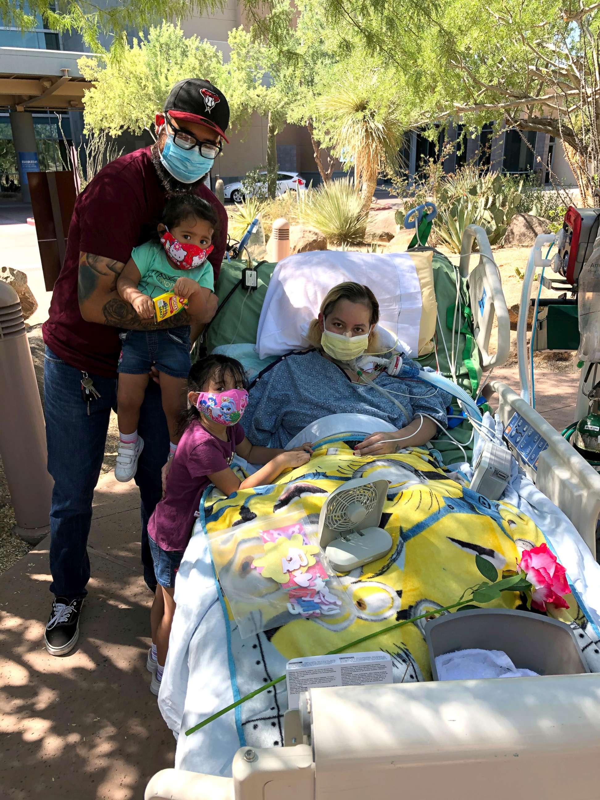 PHOTO: Reyna Lopez poses with her daughters and husband while hospitalized during her recovery from COVID-19.