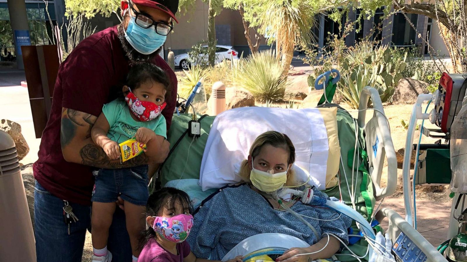 PHOTO: Reyna Lopez poses with her daughters and husband while hospitalized during her recovery from COVID-19.