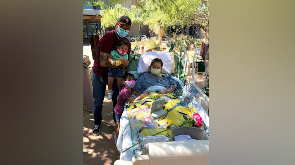 PHOTO: Reyna Lopez poses with her daughters and husband while hospitalized during her recovery from COVID-19.