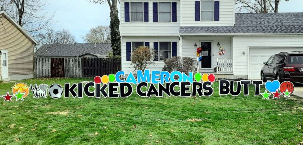 PHOTO: A banner on three-year-old Cameron's lawn welcomes him home.