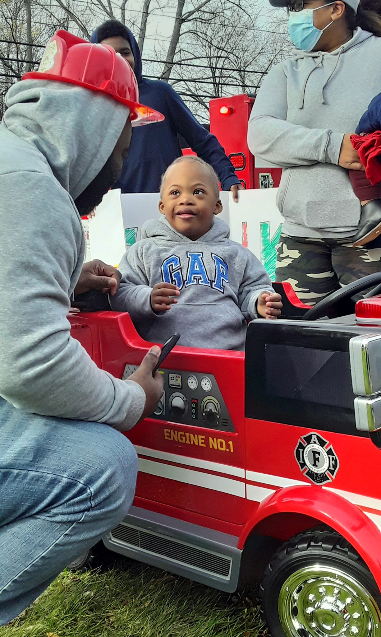 PHOTO: Cameron Peete sitting in his brand new toy firetruck.