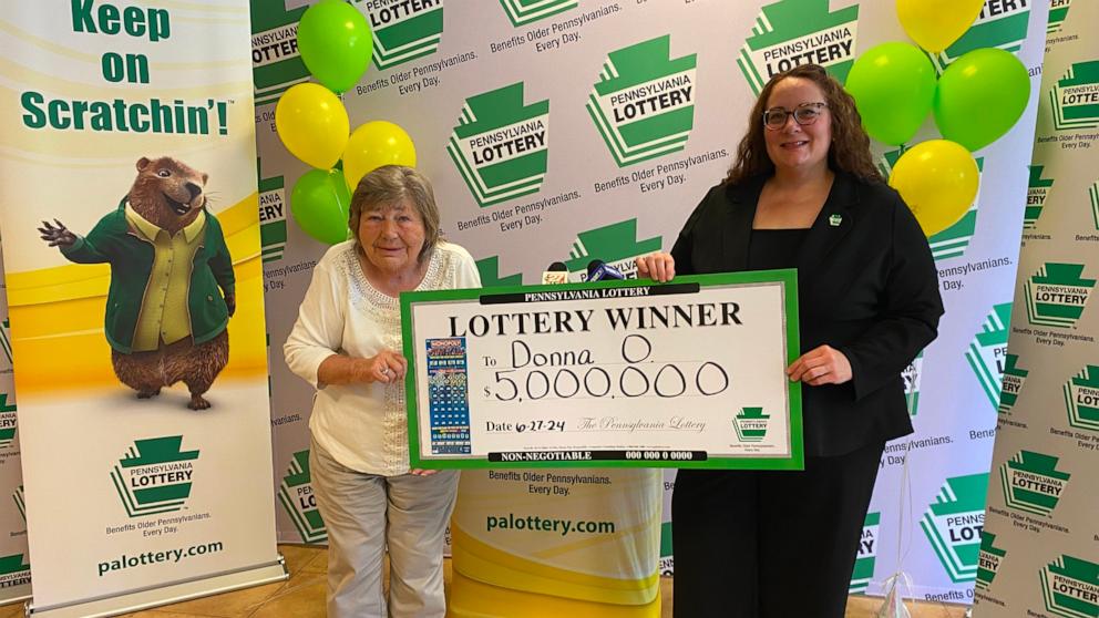 PHOTO: Lottery winner Donna Osborne, left, poses with Staci Coombs, deputy director of corporate sales for the Pennsylvania Lottery.