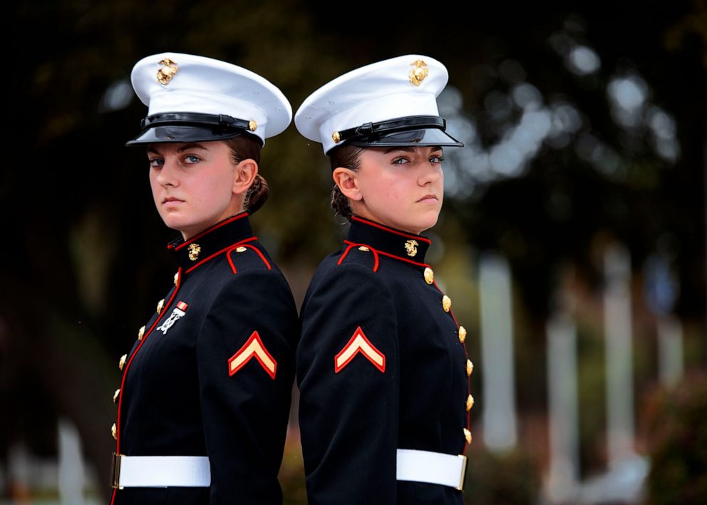 PHOTO: Sisters Ashley and Amber Valentine stand back to back.