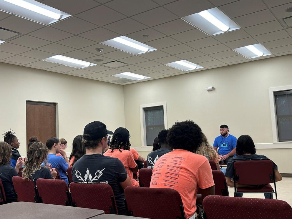 PHOTO: Campers at Camp Mariposa in Sarasota, Florida, listen to a guest speaker describe a childhood surrounded by addiction.