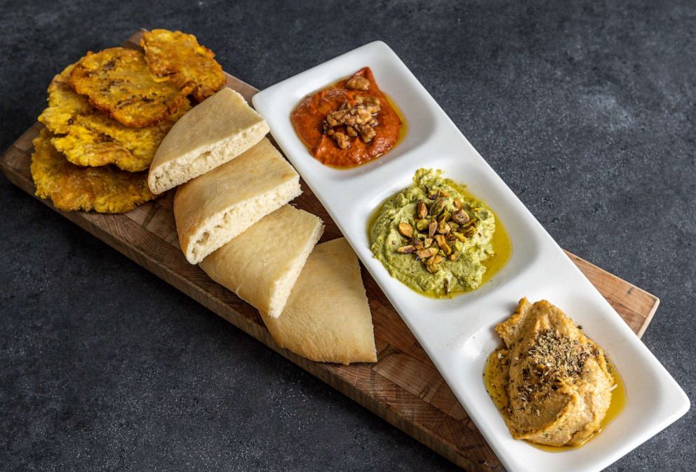 PHOTO: A trio of dips with house-made flatbread and fried plantains.