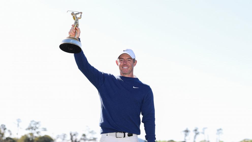 PHOTO: Rory McIlroy of Northern Ireland poses for a photo with the trophy after beating JJ Spaun in a three hole play-off during the final round of THE PLAYERS Championship 2025 at TPC Sawgrass, March 17, 2025, in Ponte Vedra Beach, Fla.