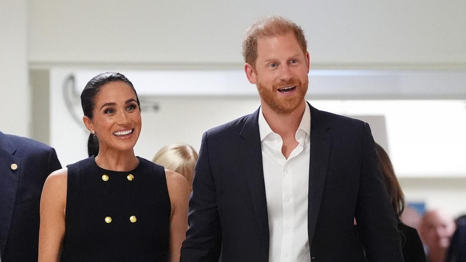 Britain's Prince Harry (R), Duke of Sussex, and his wife Meghan (L), the Duchess of Sussex in Melbourne on April 14, 2026.