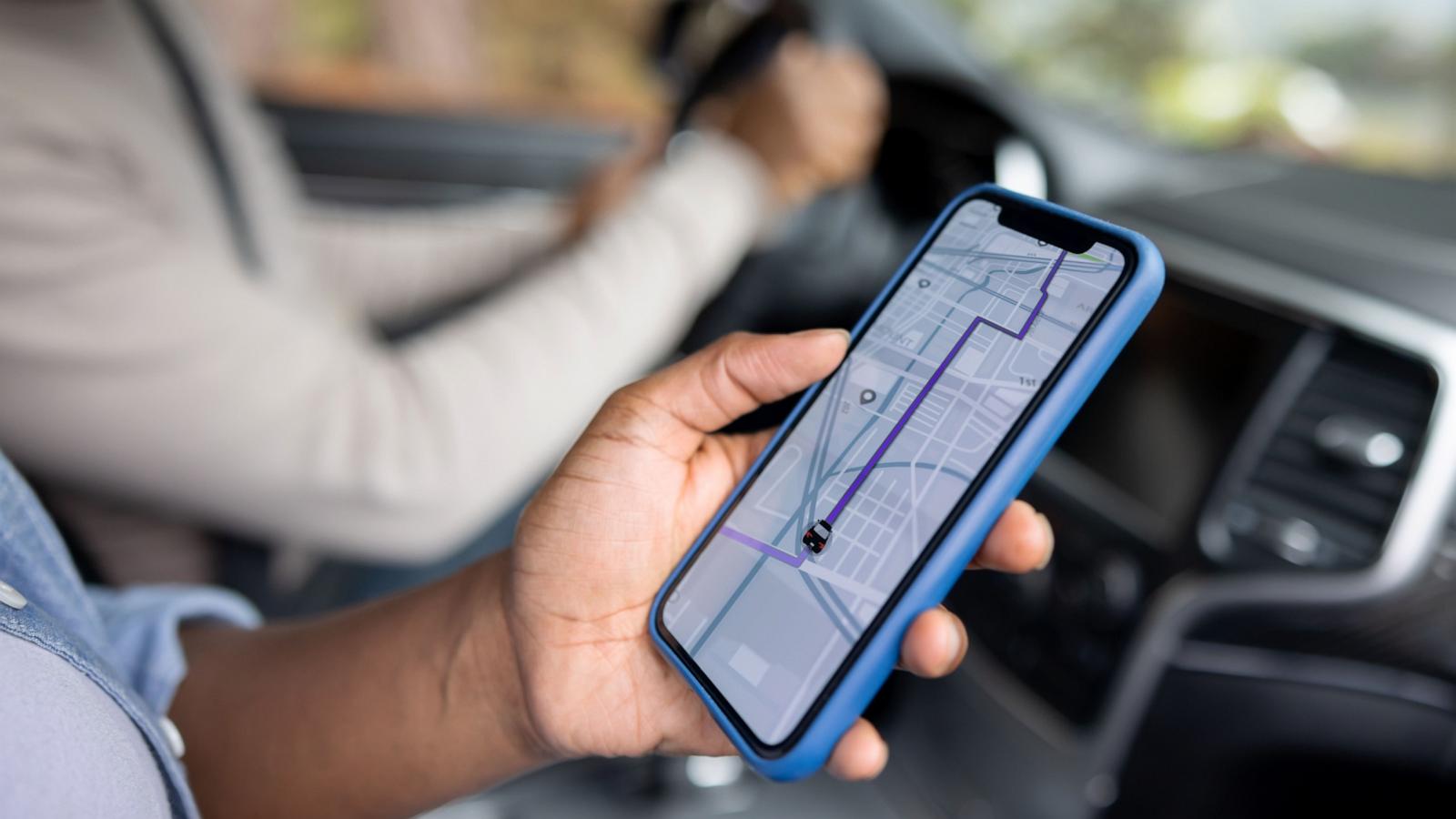 PHOTO: Close-up on a couple using the GPS while driving a car