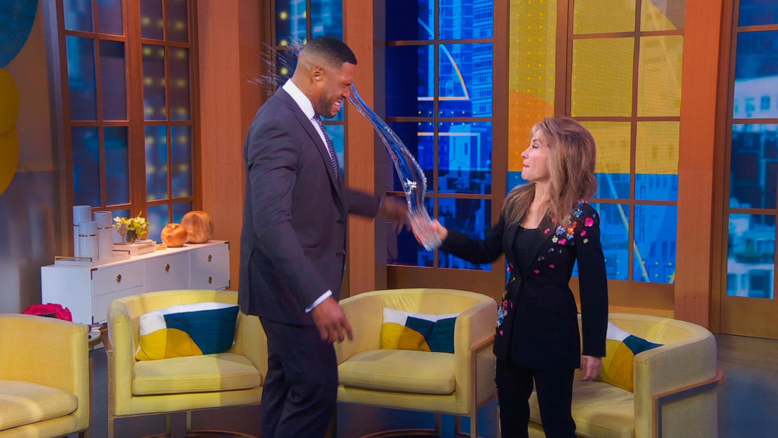 PHOTO: Actress Susan Lucci tosses a glass of water on host Michael Strahan on Good Morning America, Feb. 24, 2024.