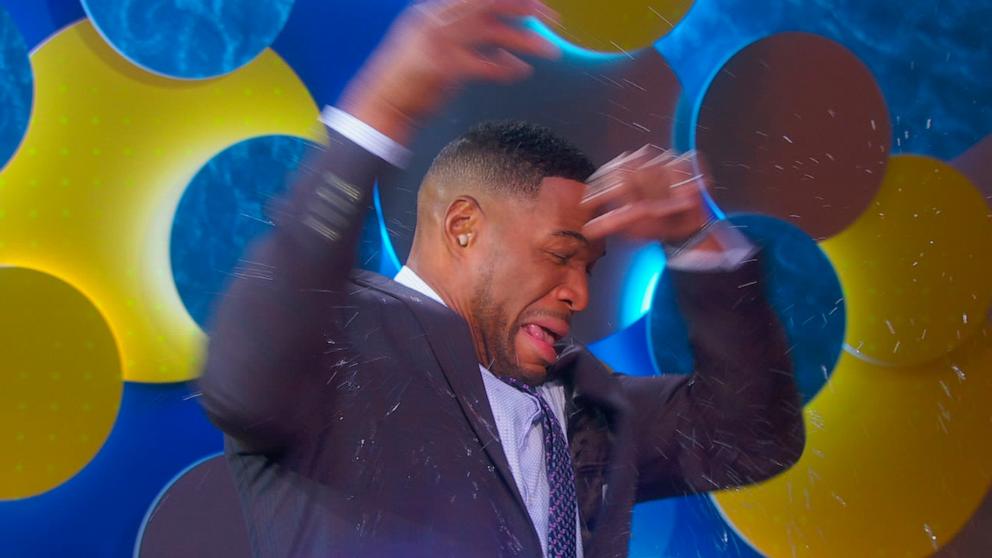 PHOTO: Actress Susan Lucci tosses a glass of water on host Michael Strahan on Good Morning America, Feb. 24, 2024.