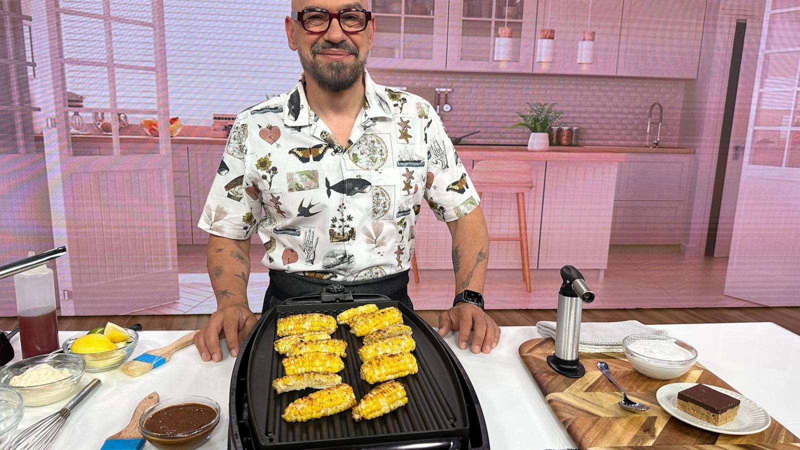 PHOTO: Chef Michael Symon grills corn for a Father's Day cookout on "Good Morning America."