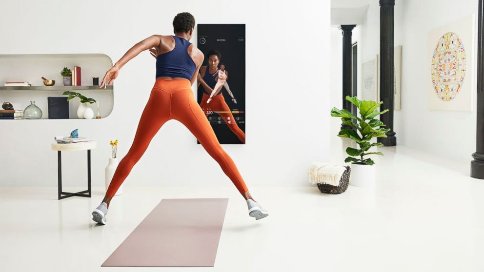 PHOTO: A user demonstrates a workout with Mirror.