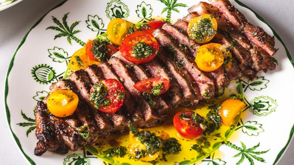 PHOTO: A New York strip steak with summer tomatoes.