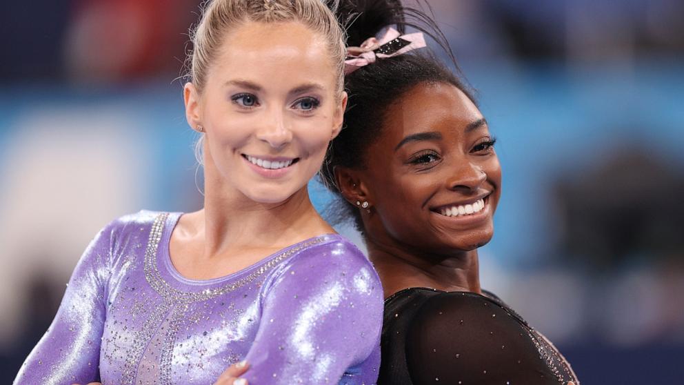 PHOTO: Mykayla Skinner and Simone Biles of the U.S. pose for a photo during women's podium training at the 2020 Tokyo Olympics, July 22, 2021.