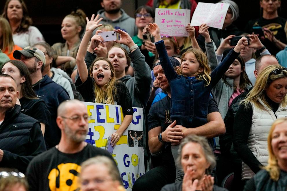 PHOTO: Fans cheer as Iowa takes the court during practice for the NCAA Women's Final Four championship basketball game in Cleveland, OH, April 6, 2024.