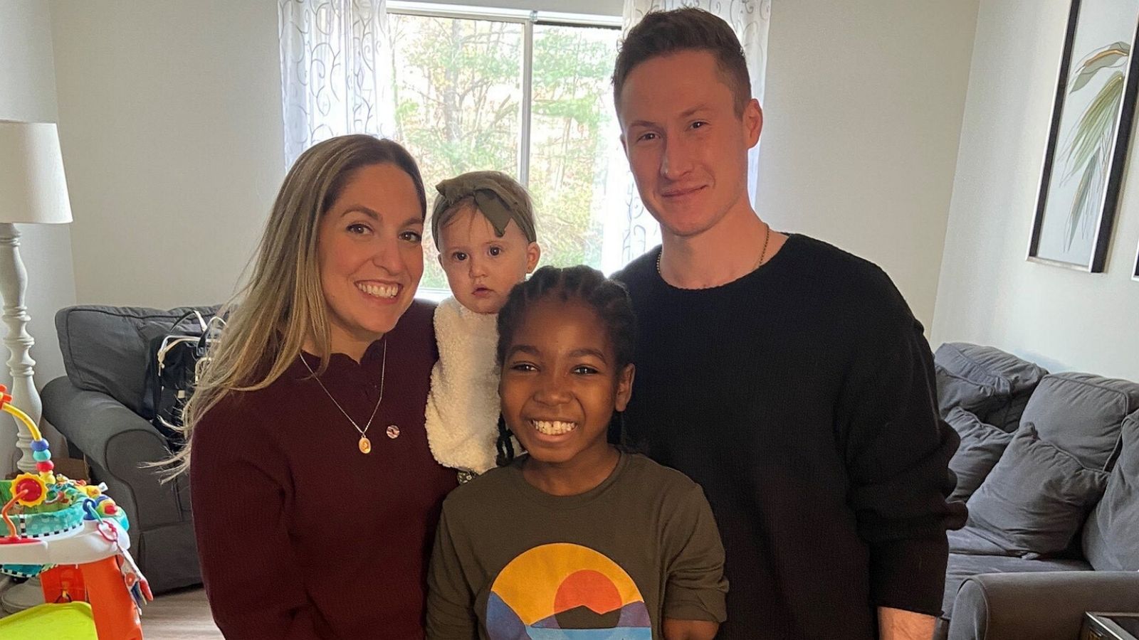 PHOTO: Nate (center) smiles for a photo with his parents Jenna and Tim and baby sister Julien.