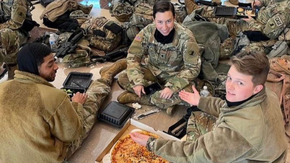 PHOTO: National Guard troops enjoy donated food from We, The Pizza while stationed inside the Capitol Building.