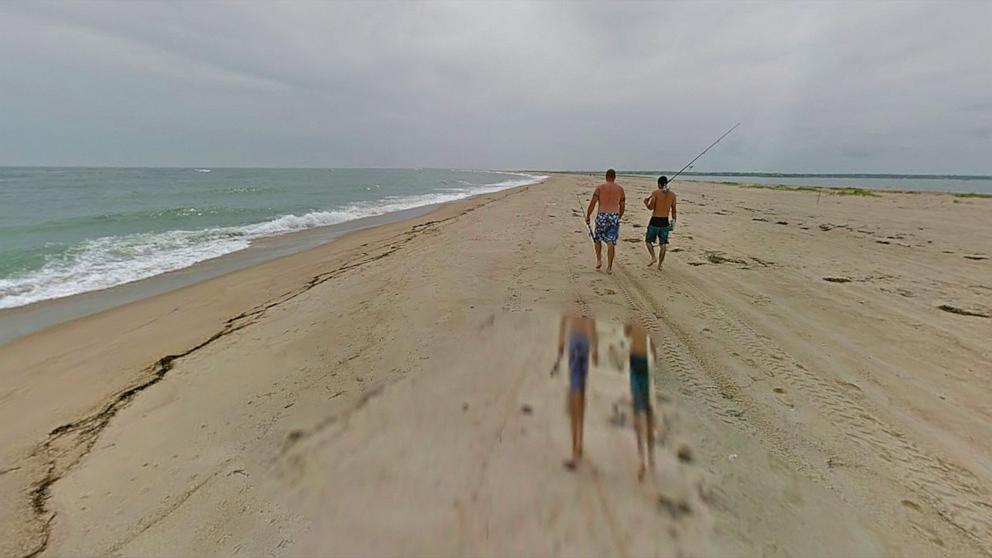 Woman pulled bleeding from water as officials suspect shark bite