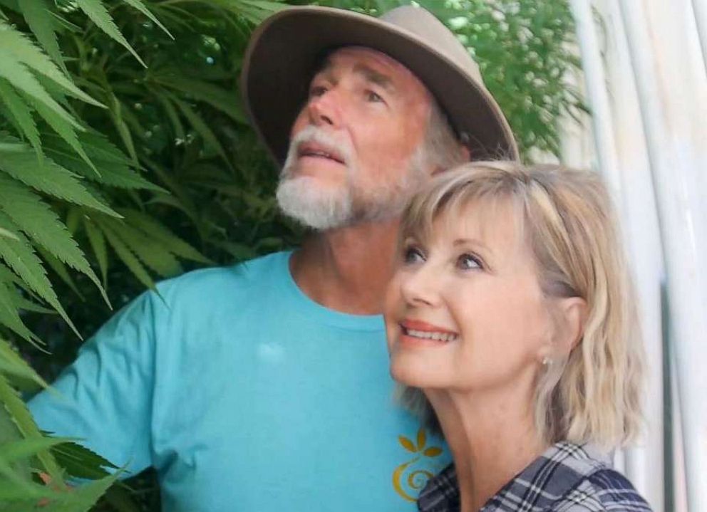 PHOTO: Olivia Newton-John is photographed with her husband John Easterling in their cannabis greenhouse at their California home.