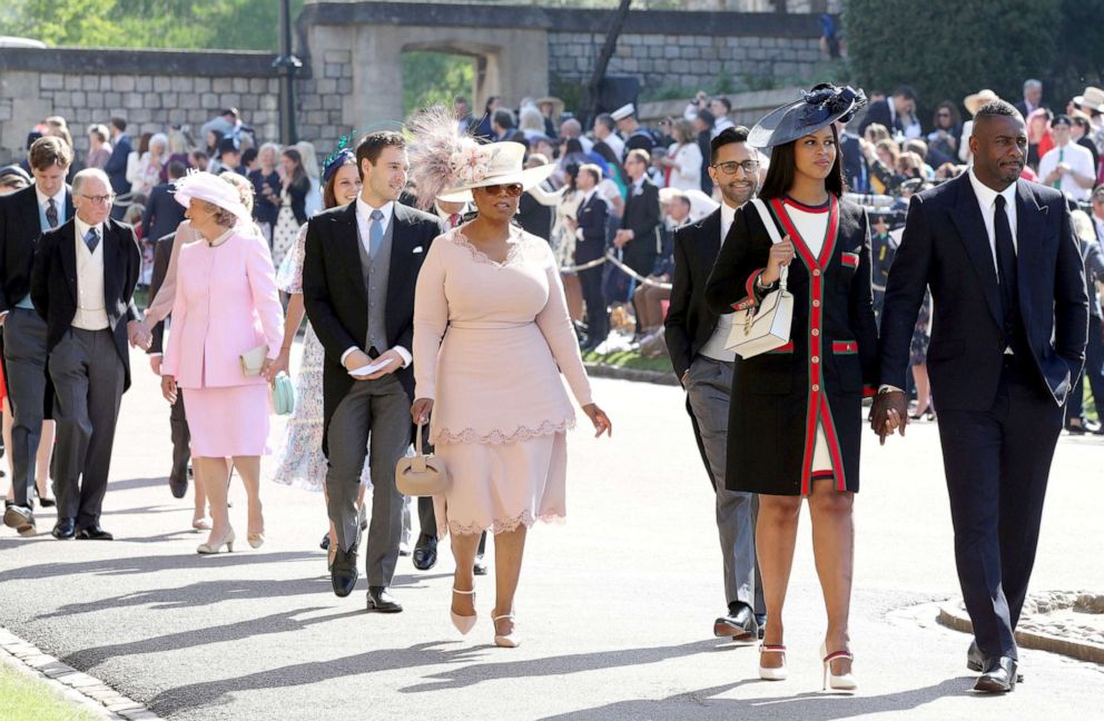 PHOTO: Oprah Winfrey, Idris Elba, Sabrina Dhowre and other guests arrive at St George's Chapel at Windsor Castle for the wedding of Meghan Markle and Prince Harry, May 19, 2018.