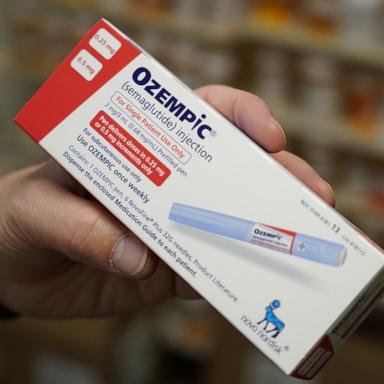 PHOTO: A pharmacist holds a box of Novo Nordisk A/S Ozempic brand semaglutide medication arranged at a pharmacy in Provo, Utah, Nov. 27, 2023.