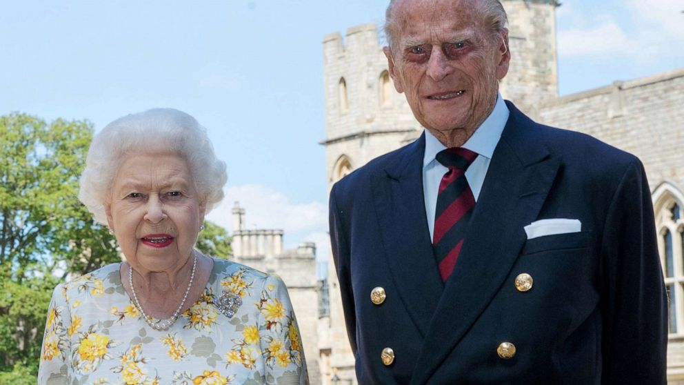 PHOTO: Britain's Queen Elizabeth II and Britain's Prince Philip, Duke of Edinburgh, poses in the quadrangle of Windsor Castle ahead of his 99th birthday, June 6, 2020. 