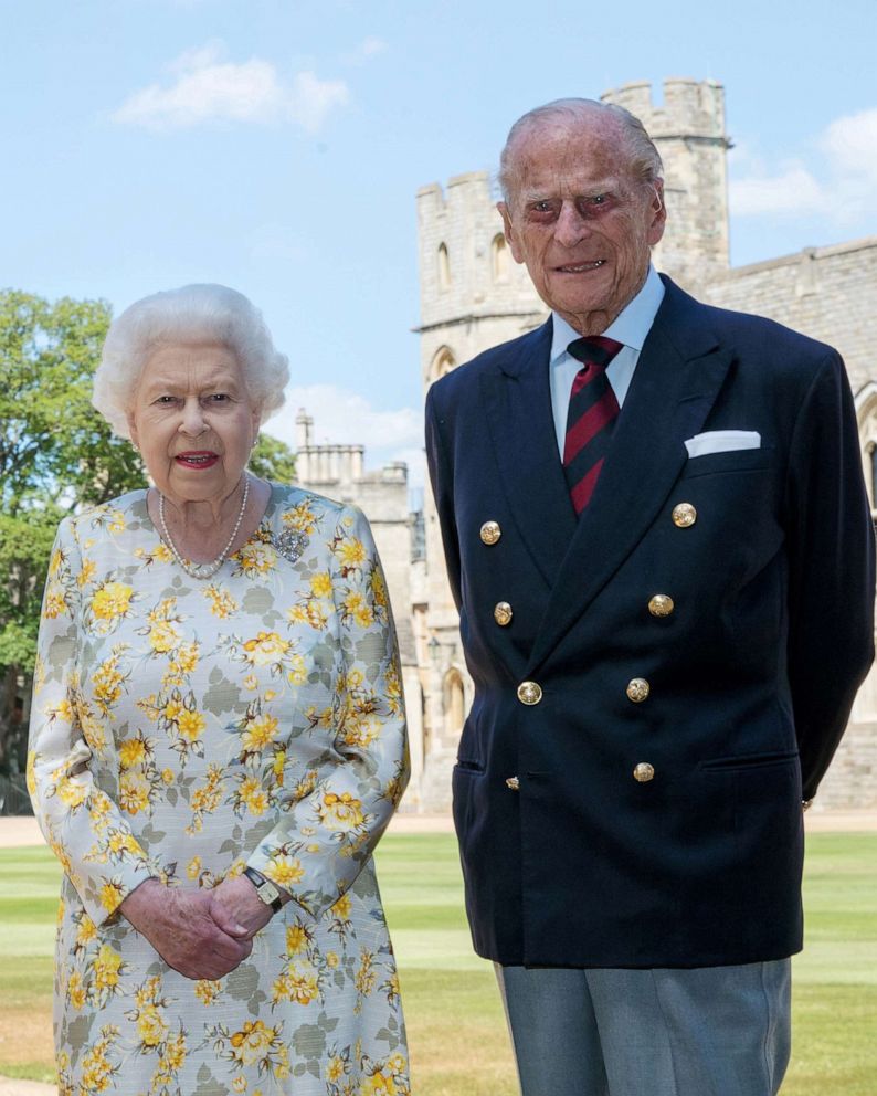 PHOTO: Britain's Queen Elizabeth II and Britain's Prince Philip, Duke of Edinburgh, poses in the quadrangle of Windsor Castle ahead of his 99th birthday, June 6, 2020. 