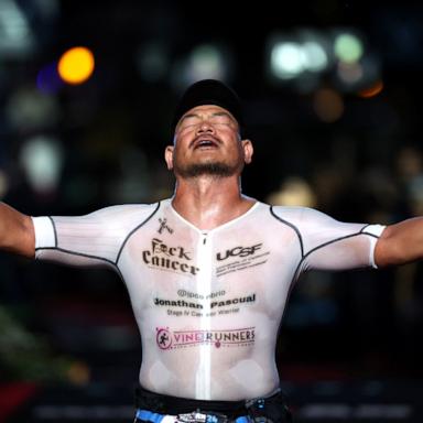 PHOTO: Jonathan Pasqual of United States celebrates completing the VinFast IRONMAN World Championship, Oct. 26, 2024, in Kailua Kona, Hawaii. 