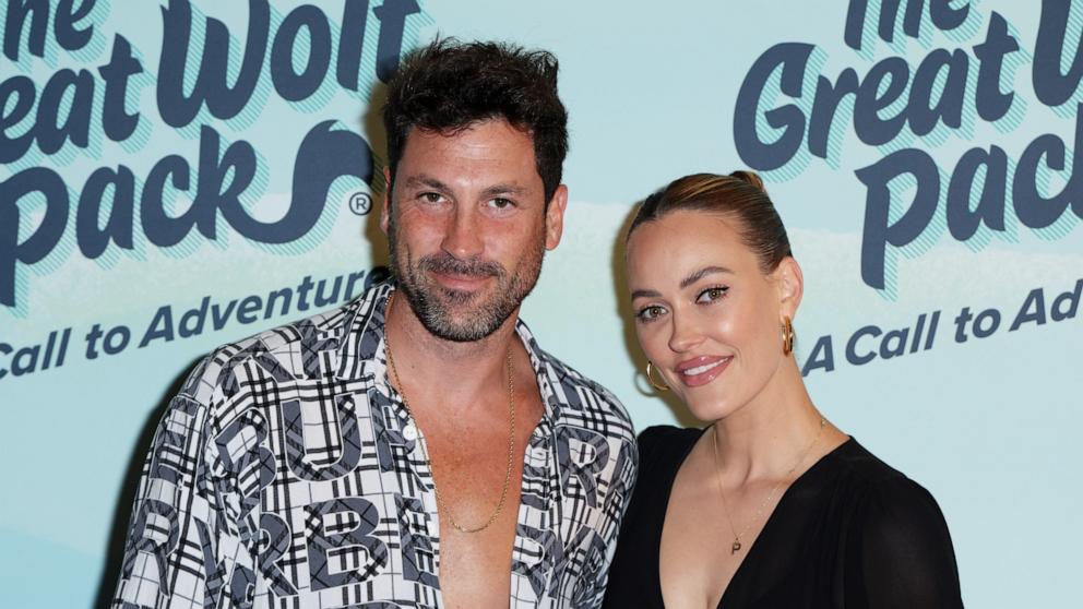 PHOTO: Maksim Chmerkovskiy and Peta Murgatroyd attend "The Great Wolf Pack: A Call to Adventure" event at Great Wolf Lodge in Garden Grove, CA, 2022.