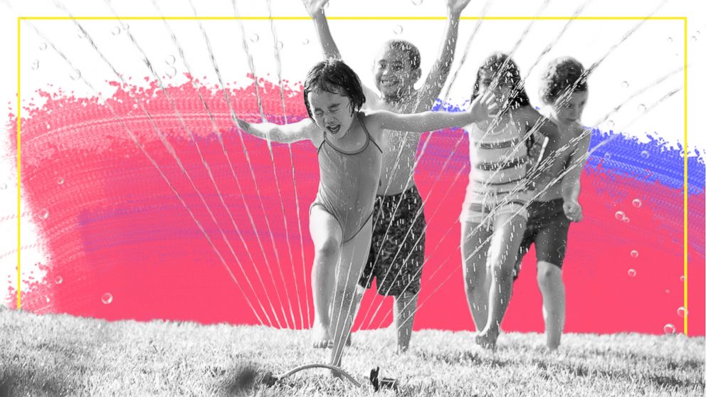 PHOTO: Children run through a water sprinkler in this undated stock photo.