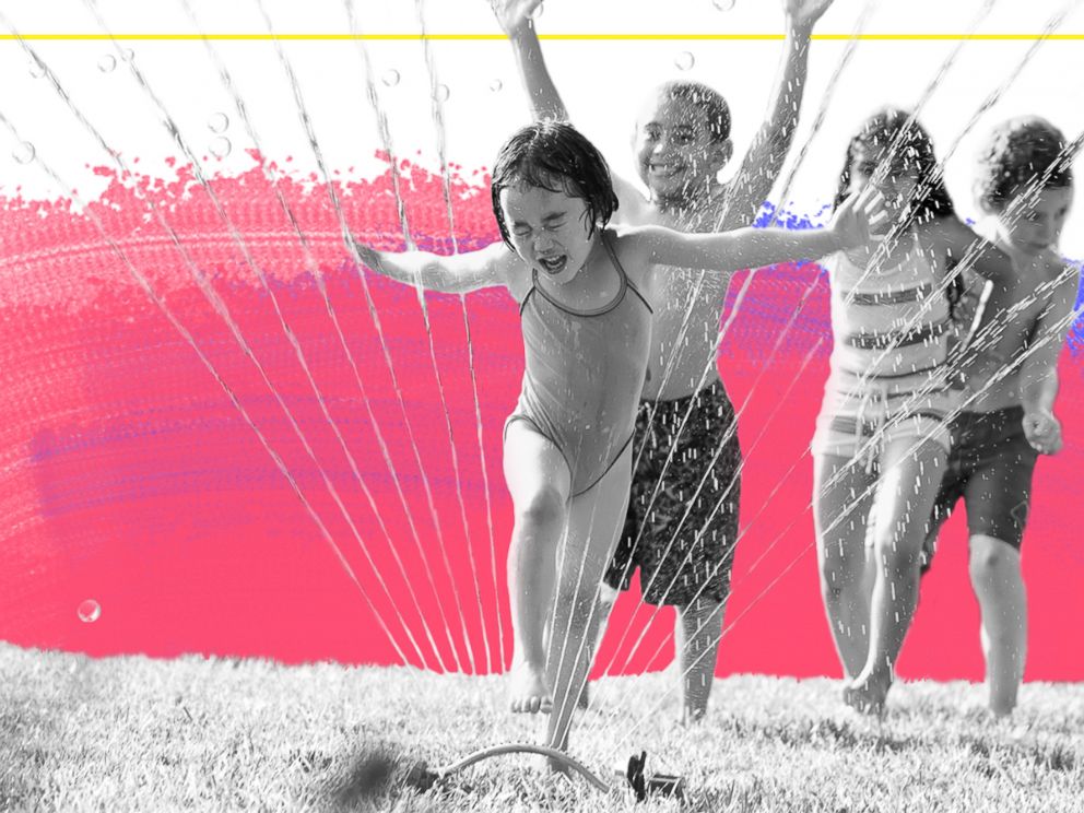 PHOTO: Children run through a water sprinkler in this undated stock photo.