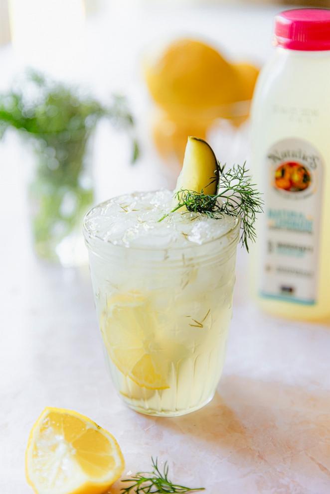 PHOTO: A glass of fresh pickle lemonade with a sprig of dill.