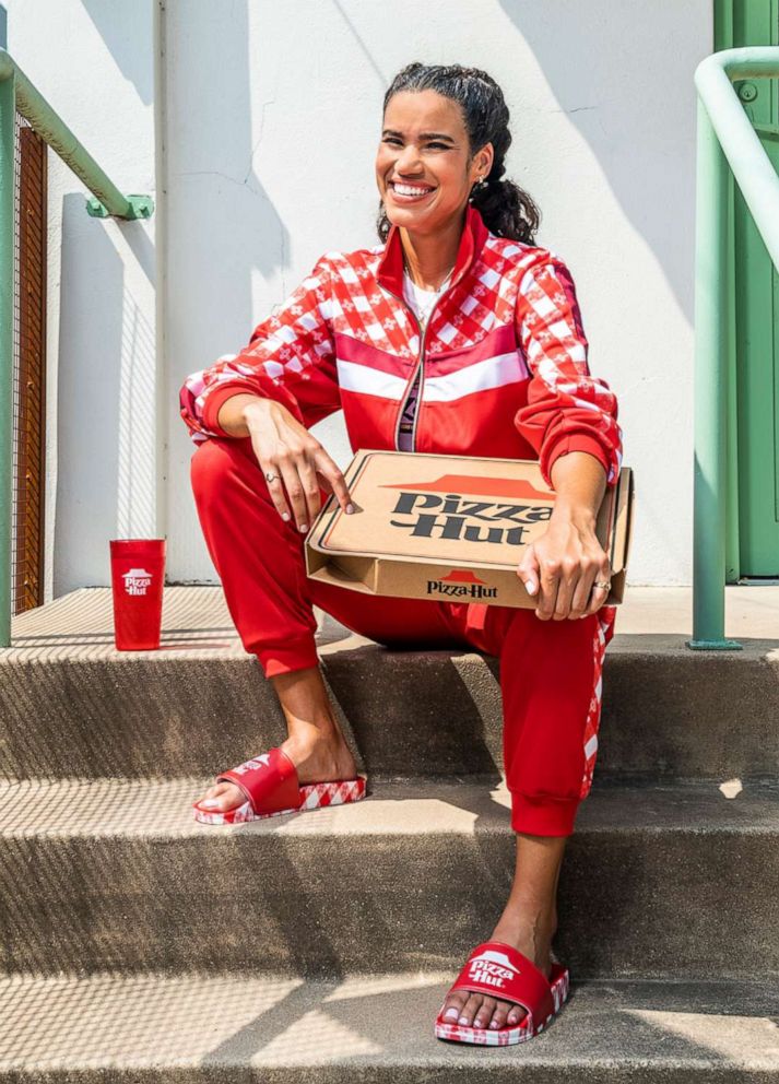 PHOTO: Model wears the Pizza Hut Tastewear track suit and slides.