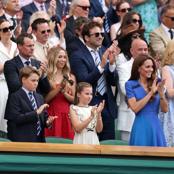 Prince William, Prince George of Wales, Princess Charlotte of Wales and Catherine, Princess of Wales, applaud from the Royal Box on day fourteen of The Championships Wimbledon 2025 on July 13, 2025 in London, England.