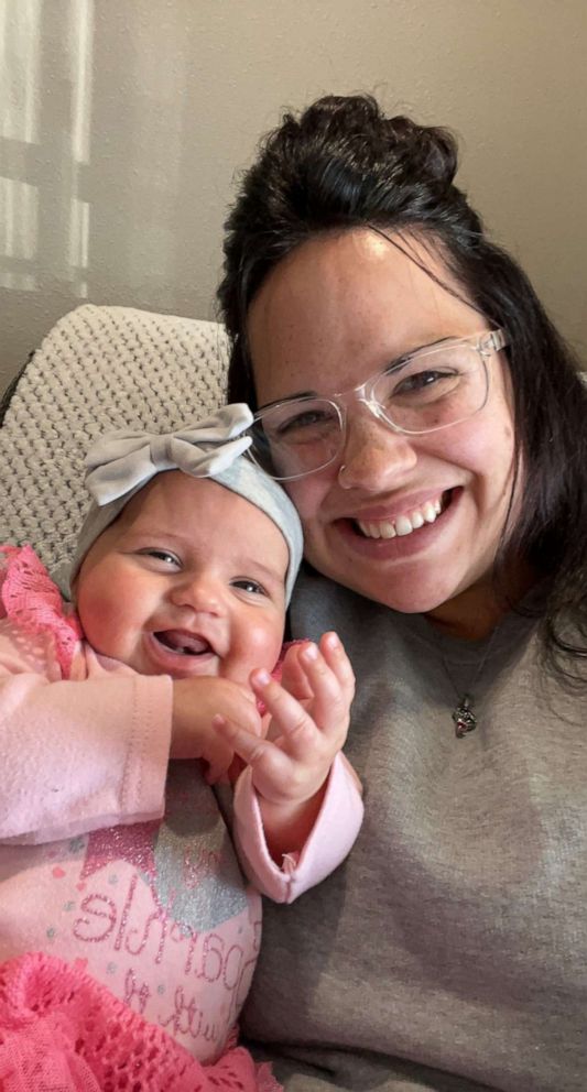  Hannah Brand, of Nebraska, holds her babe   girl  Paitynn.