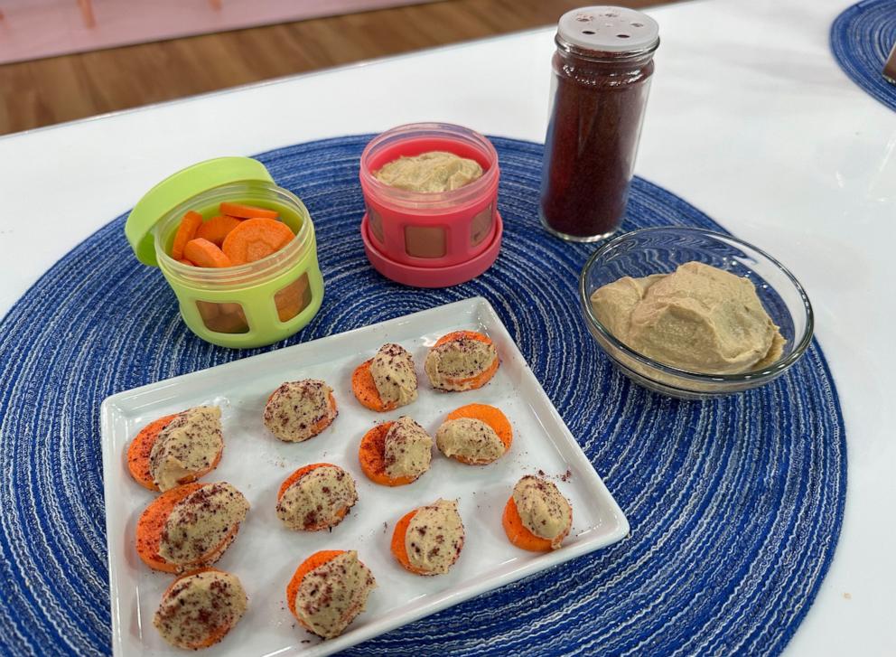PHOTO: Rachel Beller' Golden Carrot Coins with spiced hummus.