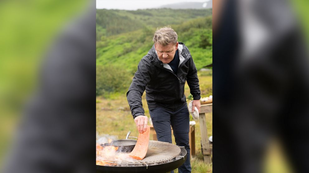 PHOTO: Rain falls as Gordon Ramsay grills fresh salmon during the final cook in Iceland.