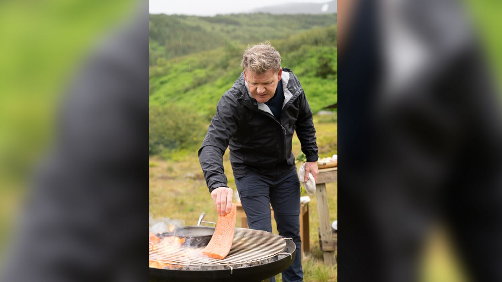 PHOTO: Rain falls as Gordon Ramsay grills fresh salmon during the final cook in Iceland.