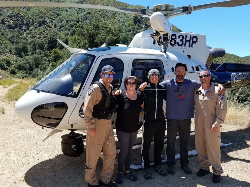 PHOTO: Pilot Joe Kingman with Curtis Whitson, Hunter Whitson and Krystal Ramirez after they were successfully rescued.