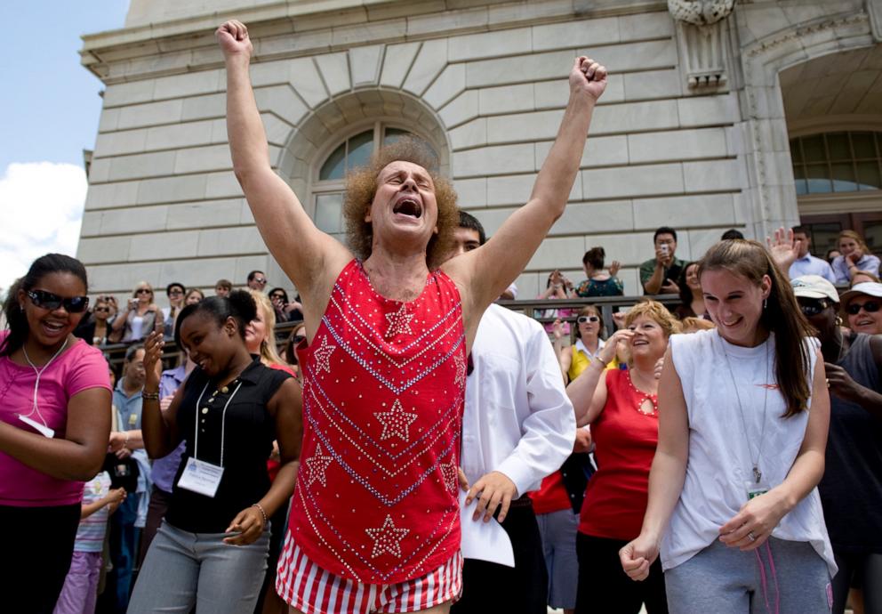 PHOTO: Richard Simmons leads the crowd on the Cannon Terrace in exercises during the "FIT Kids" rally to promote physical education in schools, Washington, DC, July 24, 2008. 