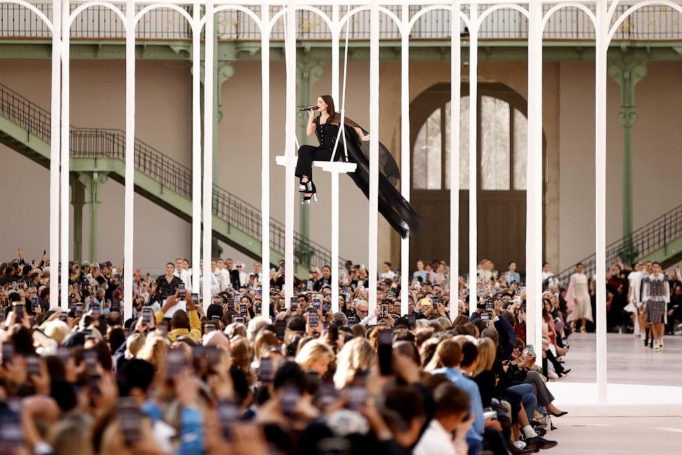 PHOTO: Riley Keough sings and swings in a massive bird cage at the Spring/Summer 2025 Women's ready-to-wear collection show at the Grand Palais during Paris Fashion Week, Oct. 1, 2024, in Paris.